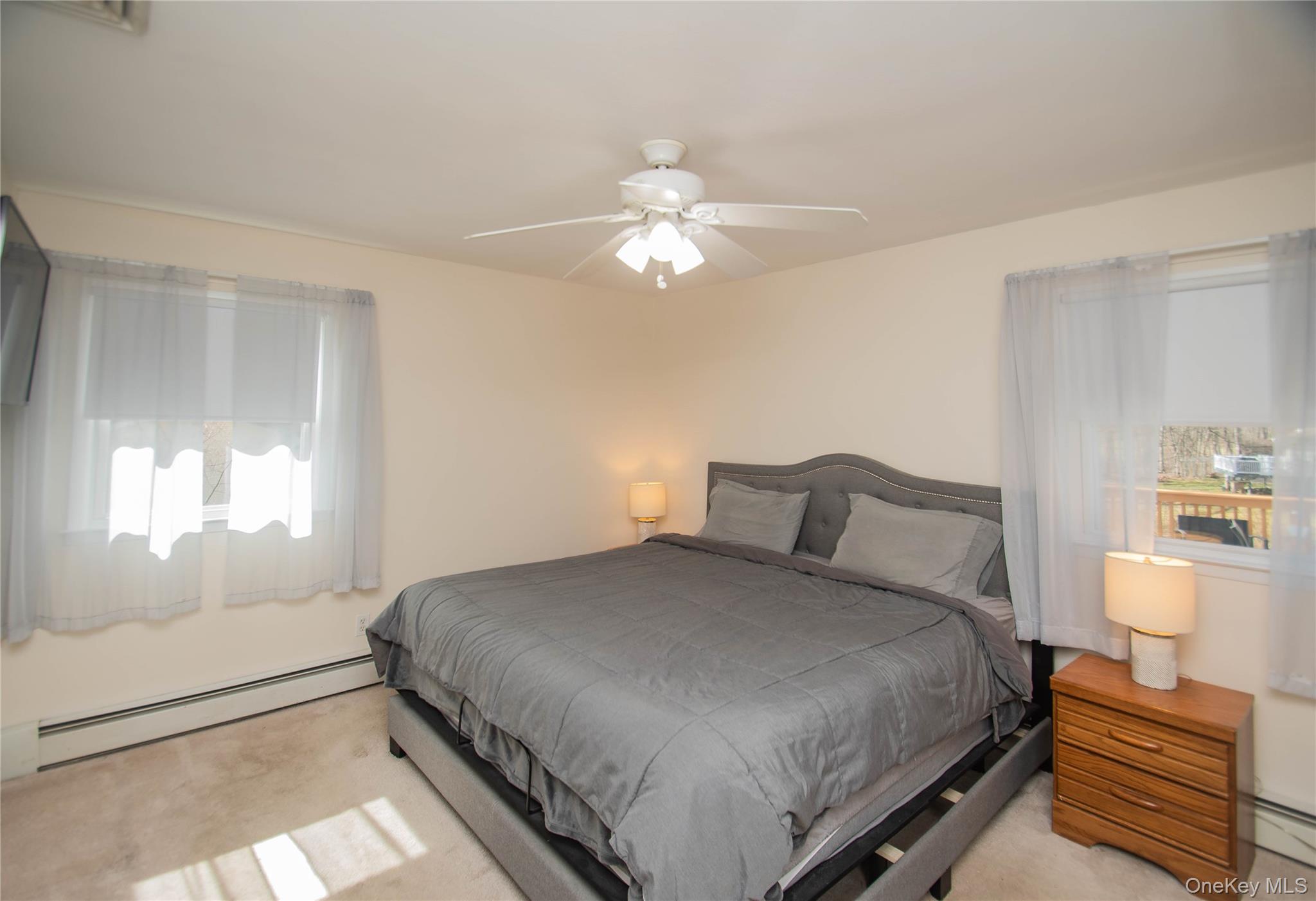 24 Montfort Road Wappingers Falls, NY 12590 - Photo 20 of 45 a bedroom with a bed and a chandelier