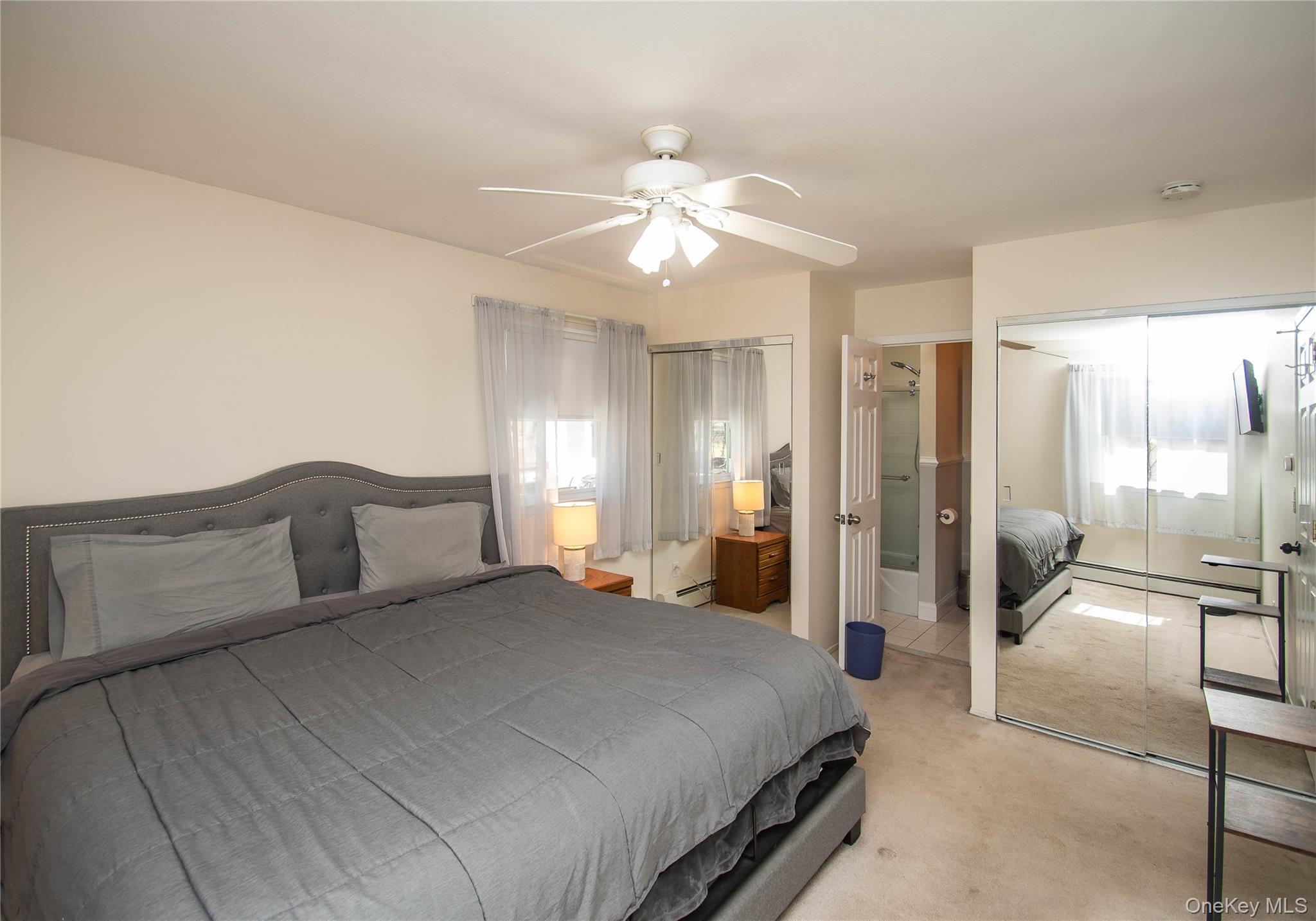 24 Montfort Road Wappingers Falls, NY 12590 - Photo 21 of 45 a bedroom with a large bed and a chandelier