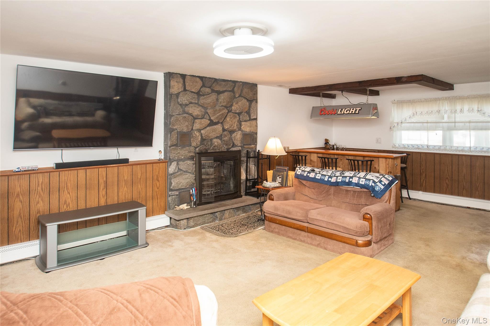 24 Montfort Road Wappingers Falls, NY 12590 - Photo 26 of 45 a living room with furniture and a flat screen tv