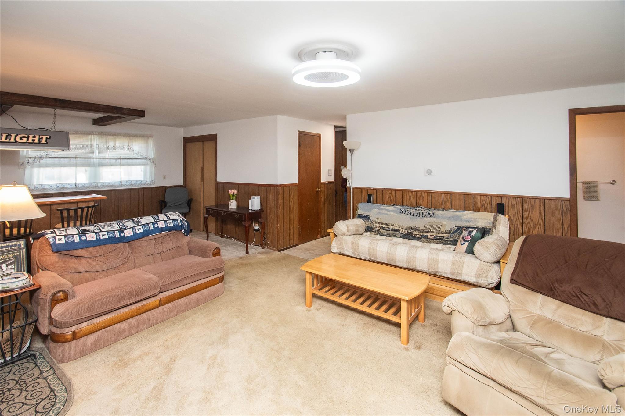 24 Montfort Road Wappingers Falls, NY 12590 - Photo 27 of 45 a living room with furniture and a lamp
