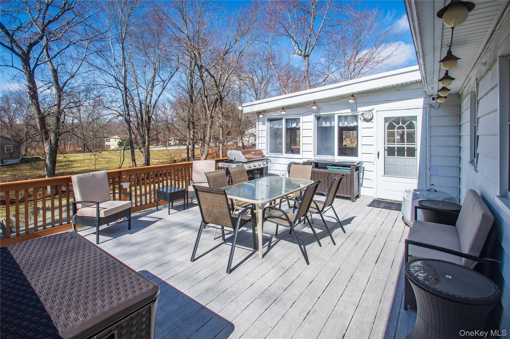 24 Montfort Road Wappingers Falls, NY 12590 - Photo 32 of 45 a view of a patio with table and chairs and couches