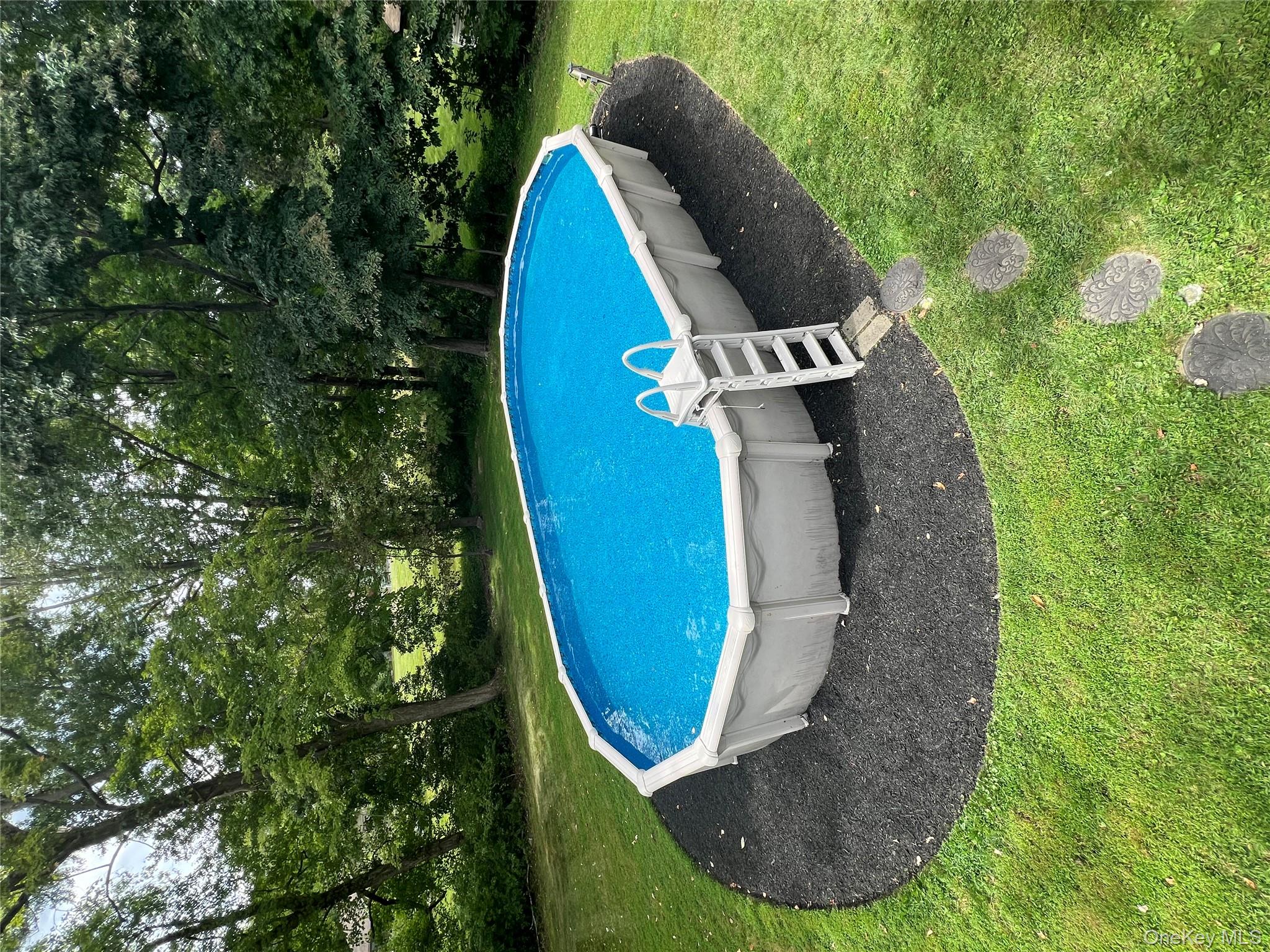 24 Montfort Road Wappingers Falls, NY 12590 - Photo 36 of 45 a view of a swimming pool with a yard