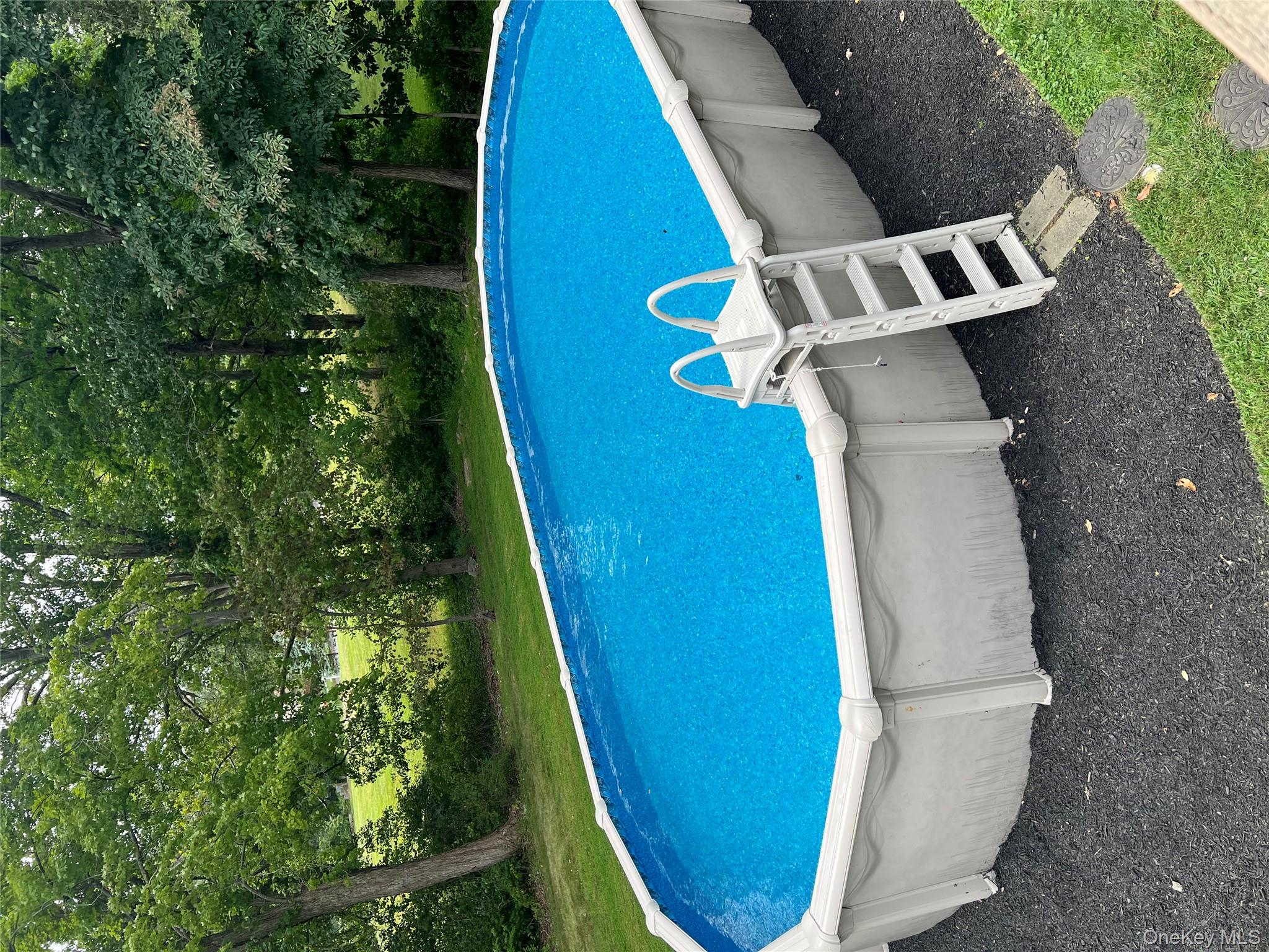 24 Montfort Road Wappingers Falls, NY 12590 - Photo 37 of 45 a view of a swimming pool with a yard