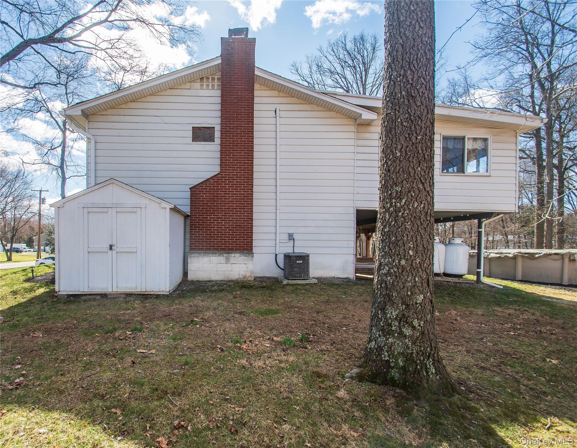 24 Montfort Road Wappingers Falls, NY 12590 - Photo 43 of 45 a view of a house with a yard and garage