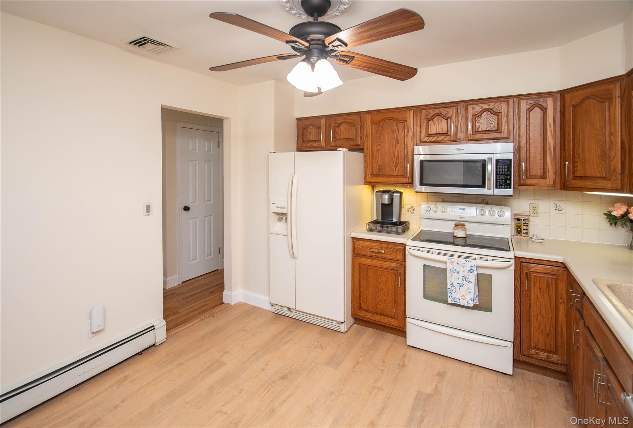 24 Montfort Road Wappingers Falls, NY 12590 - Photo 6 of 45 a kitchen with stainless steel appliances a stove microwave and a refrigerator