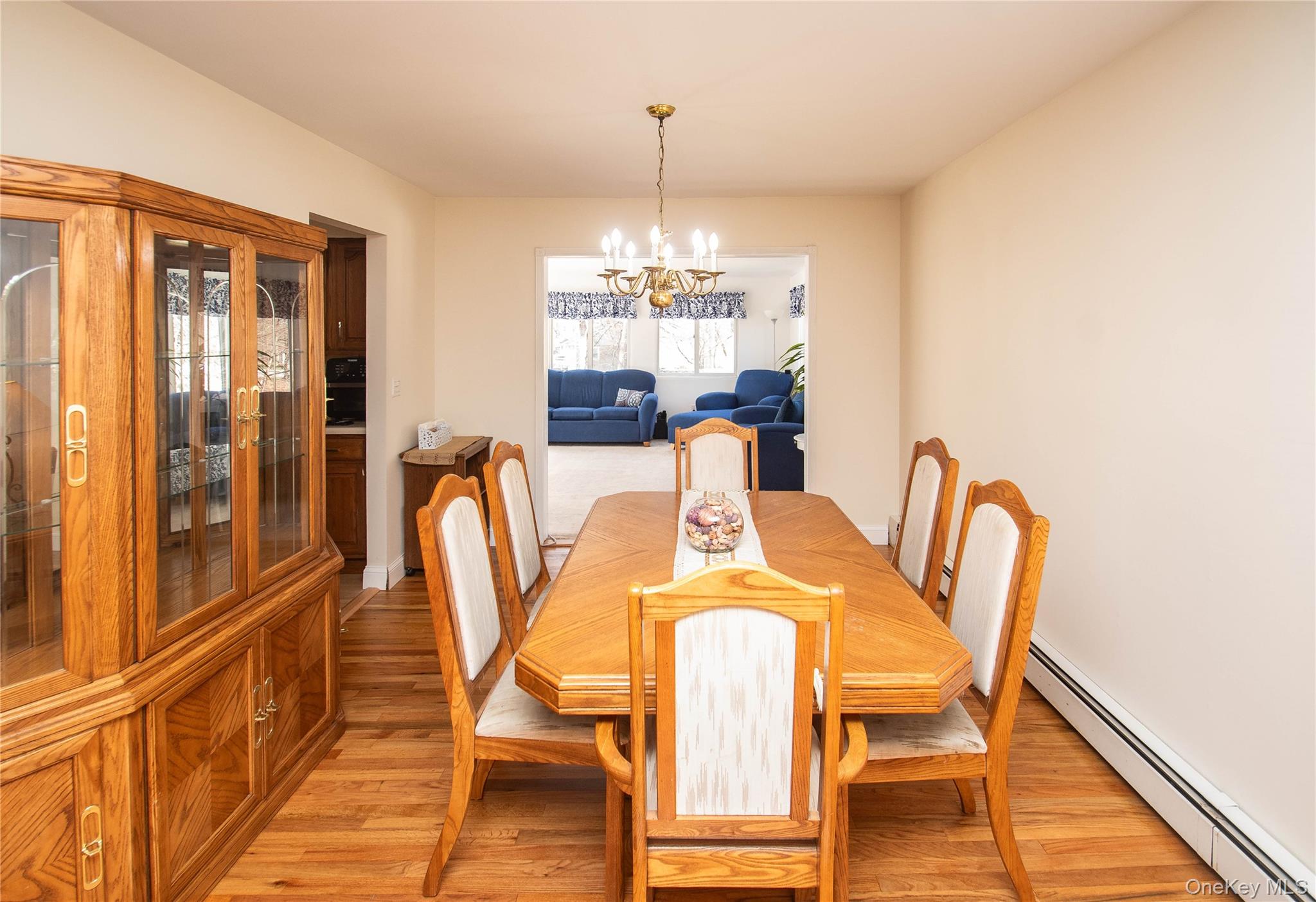 24 Montfort Road Wappingers Falls, NY 12590 - Photo 7 of 45 a dining room with furniture a chandelier and wooden floor