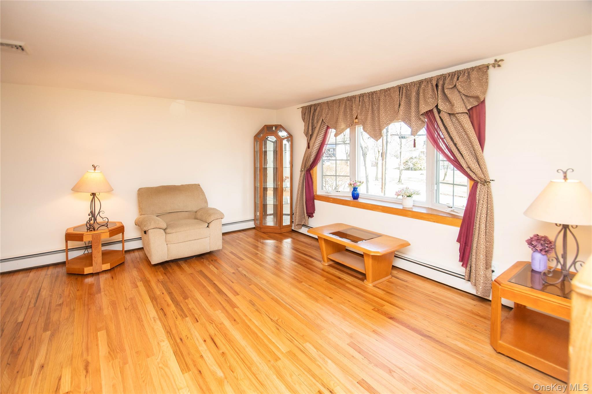 24 Montfort Road Wappingers Falls, NY 12590 - Photo 9 of 45 a living room with furniture and a large window