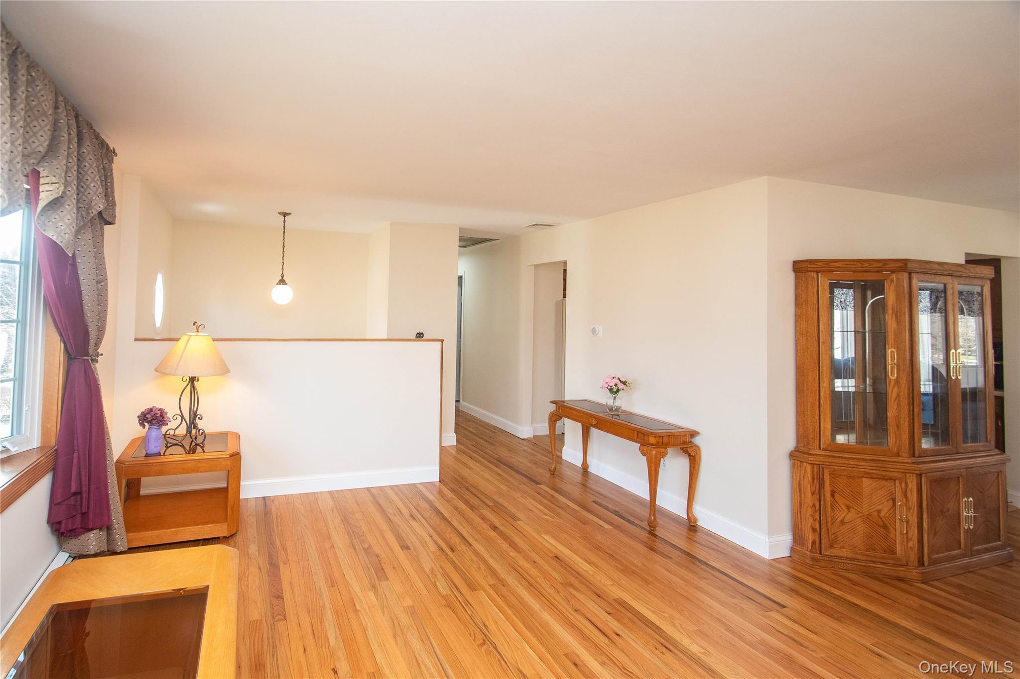 24 Montfort Road Wappingers Falls, NY 12590 - Photo 10 of 45 a view of a living room with furniture and wooden floor