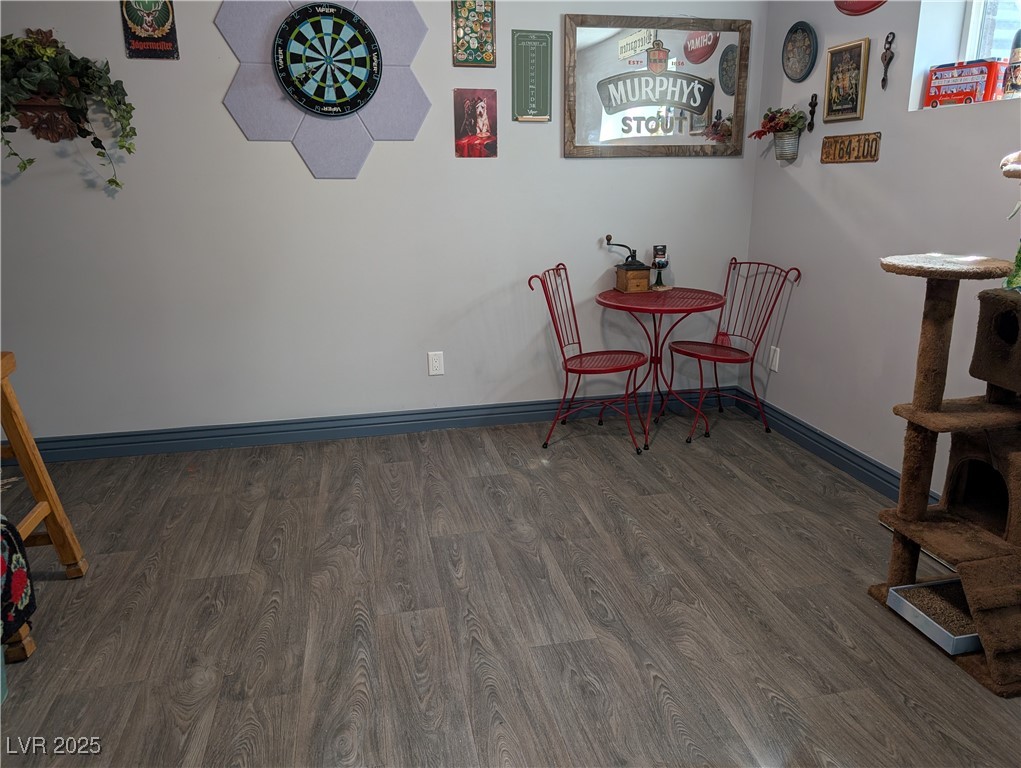 327 High Street Pioche, NV 89043 - Photo 14 of 27 Downstairs Bedroom/Office #4 with baseboards and dark wood-style floors