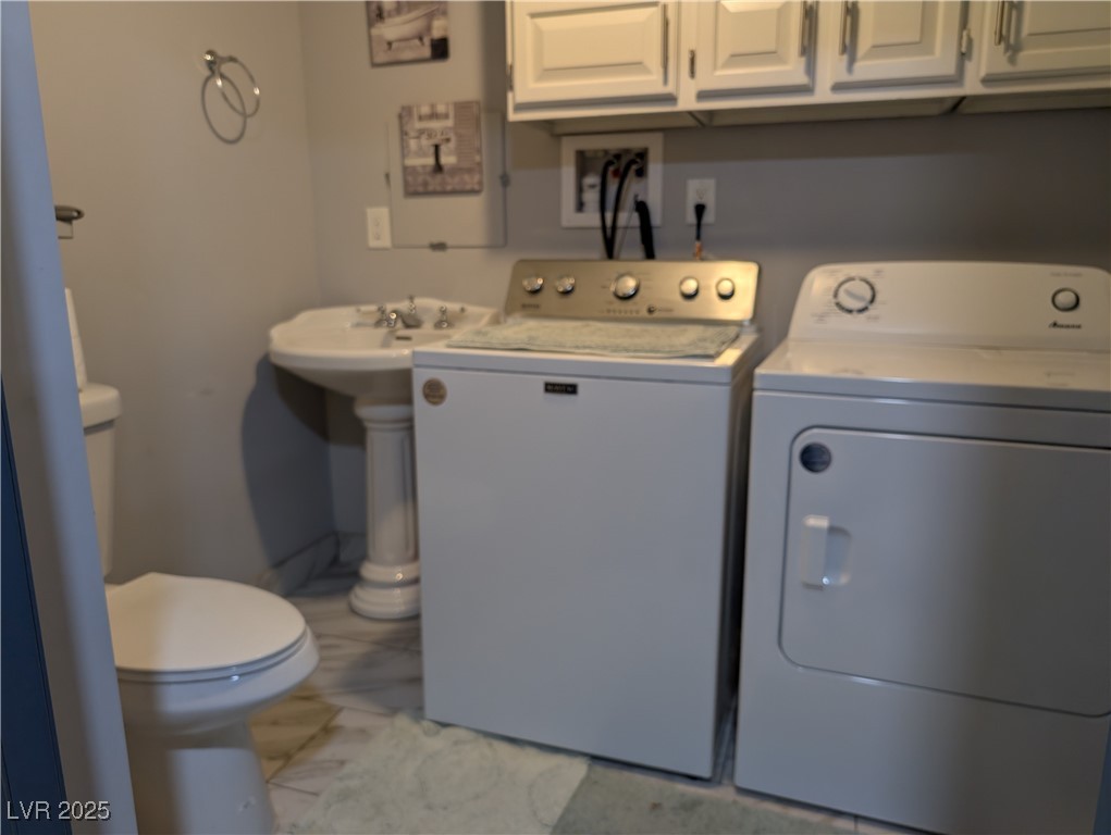327 High Street Pioche, NV 89043 - Photo 17 of 27 Downstairs Laundry area featuring washing machine and clothes dryer