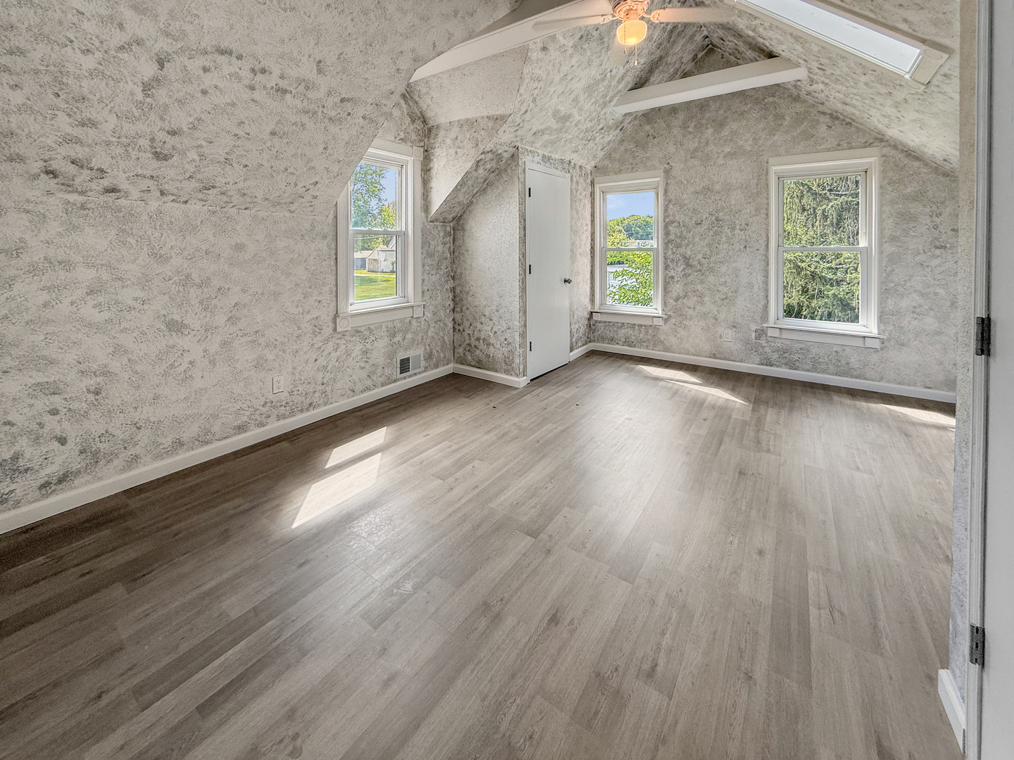 302 West Cook Street Sheffield, IL 61361 - Photo 16 of 18 an empty room with wooden floor and windows