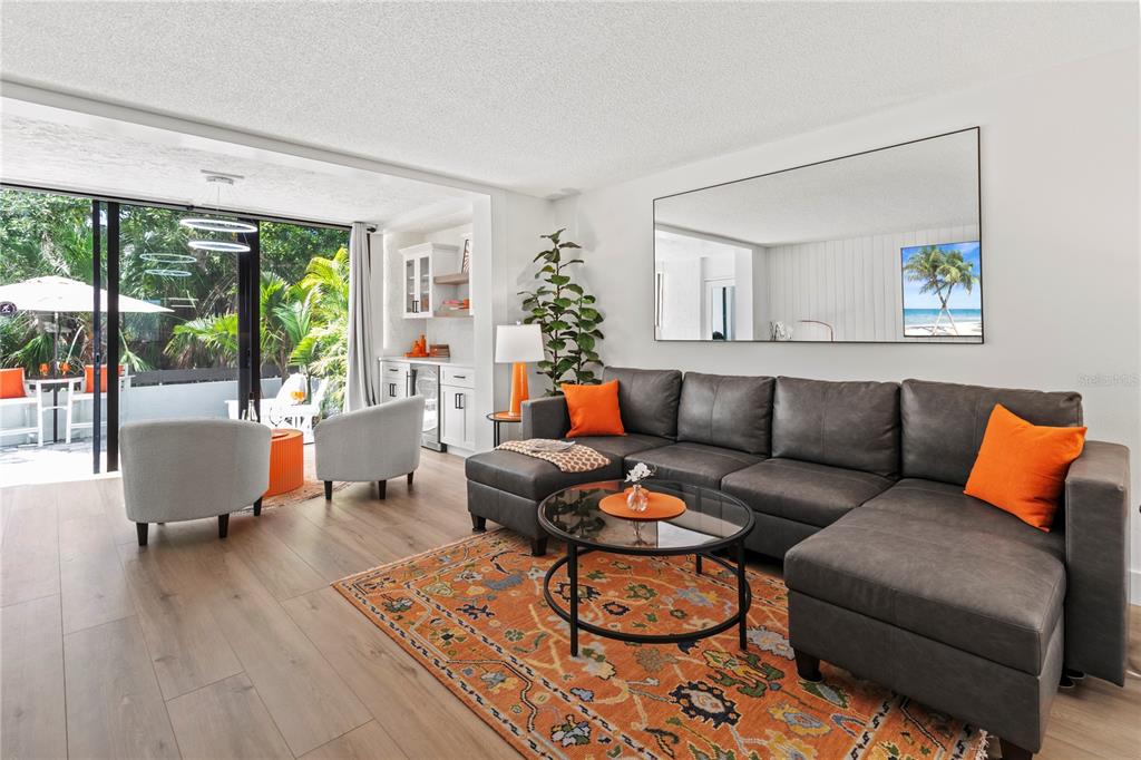 806 Bayport Way, Unit 806 Longboat Key, FL 34228 - Photo 18 of 79 a living room with furniture and a large window