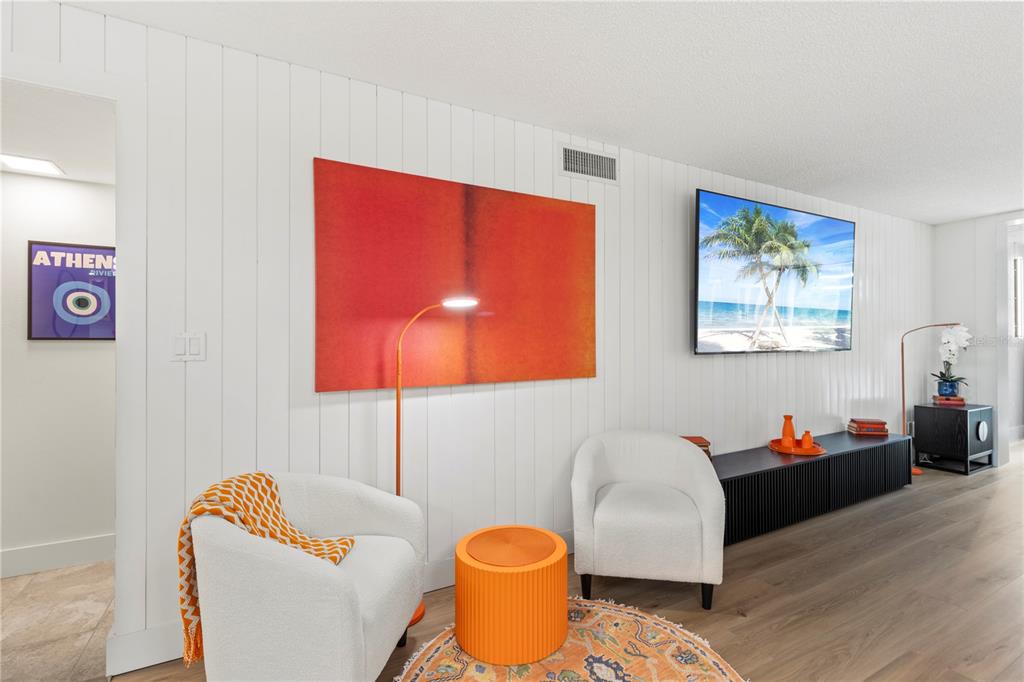 806 Bayport Way, Unit 806 Longboat Key, FL 34228 - Photo 19 of 79 a living room with furniture and a lamp