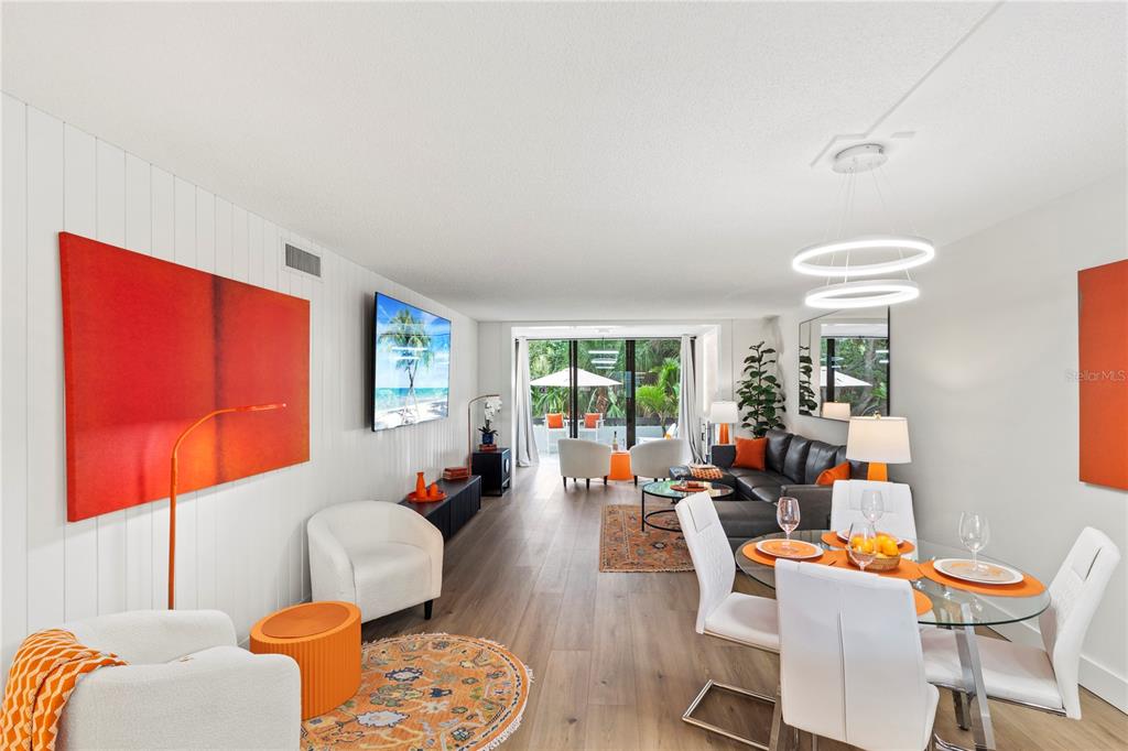 806 Bayport Way, Unit 806 Longboat Key, FL 34228 - Photo 20 of 79 a living room with furniture a rug and a large window