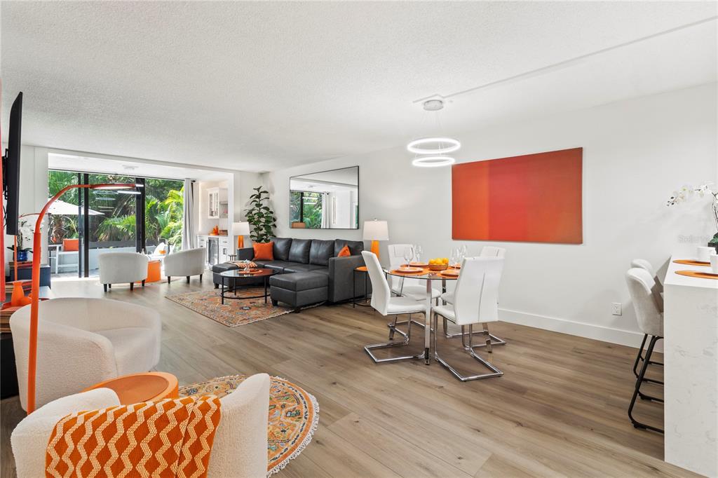 806 Bayport Way, Unit 806 Longboat Key, FL 34228 - Photo 21 of 79 a living room with furniture and a table