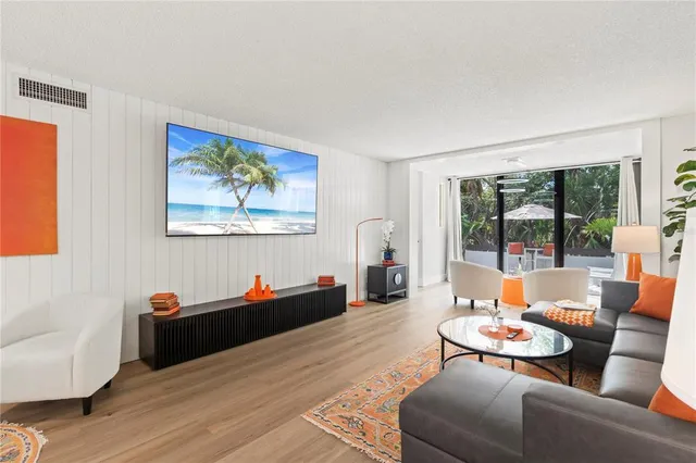 a bedroom with a bed and a lamp on dresser