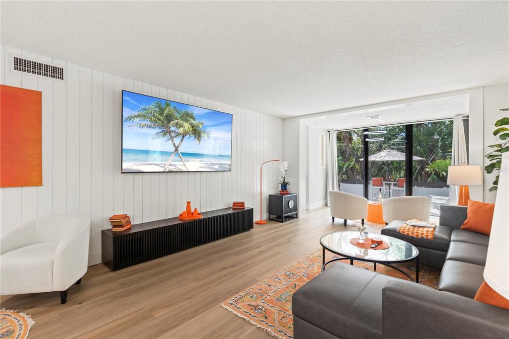 806 Bayport Way, Unit 806 Longboat Key, FL 34228 - Photo 23 of 79 a living room with furniture and a large window