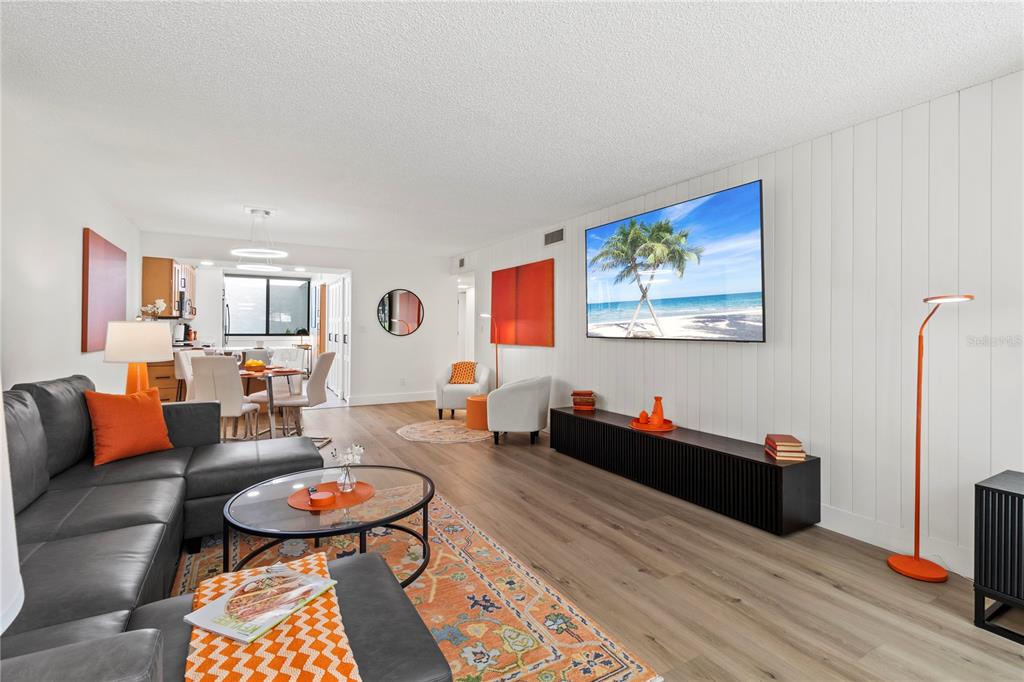 806 Bayport Way, Unit 806 Longboat Key, FL 34228 - Photo 25 of 79 a living room with furniture and wooden floor