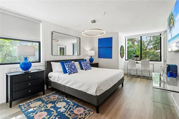 a room with a wooden floor and white walls