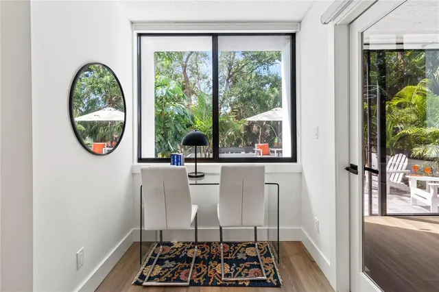 a living room with furniture and a dresser