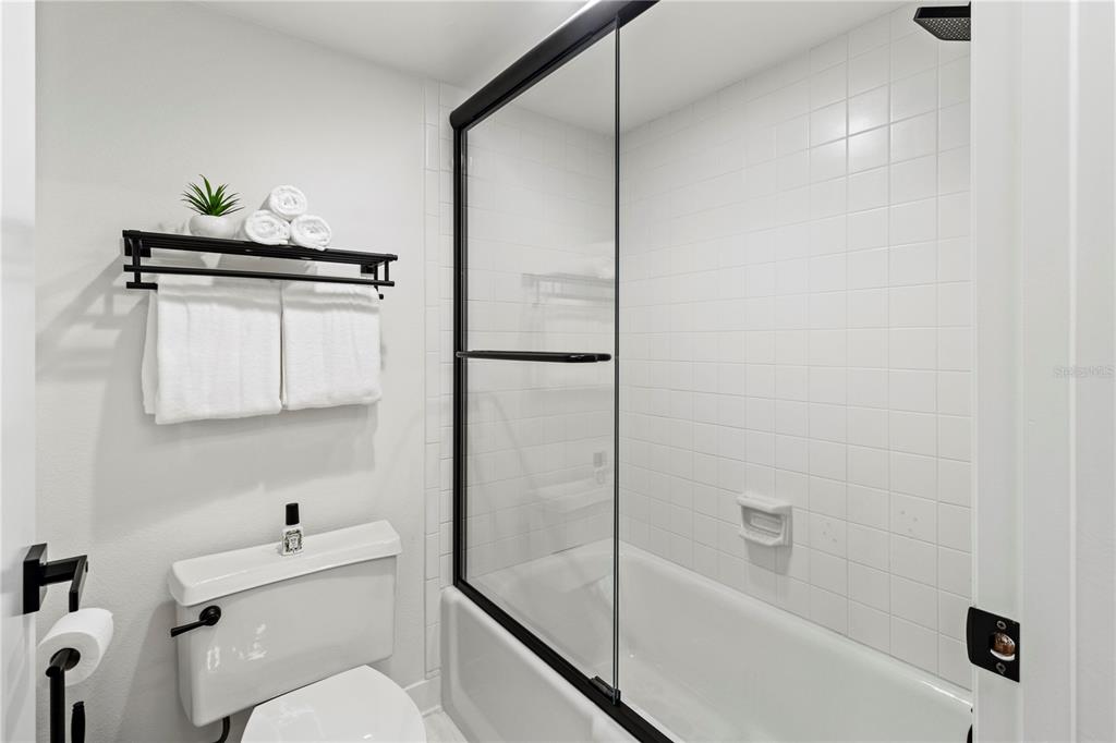 806 Bayport Way, Unit 806 Longboat Key, FL 34228 - Photo 31 of 79 a bathroom with a shower a toilet and a sink