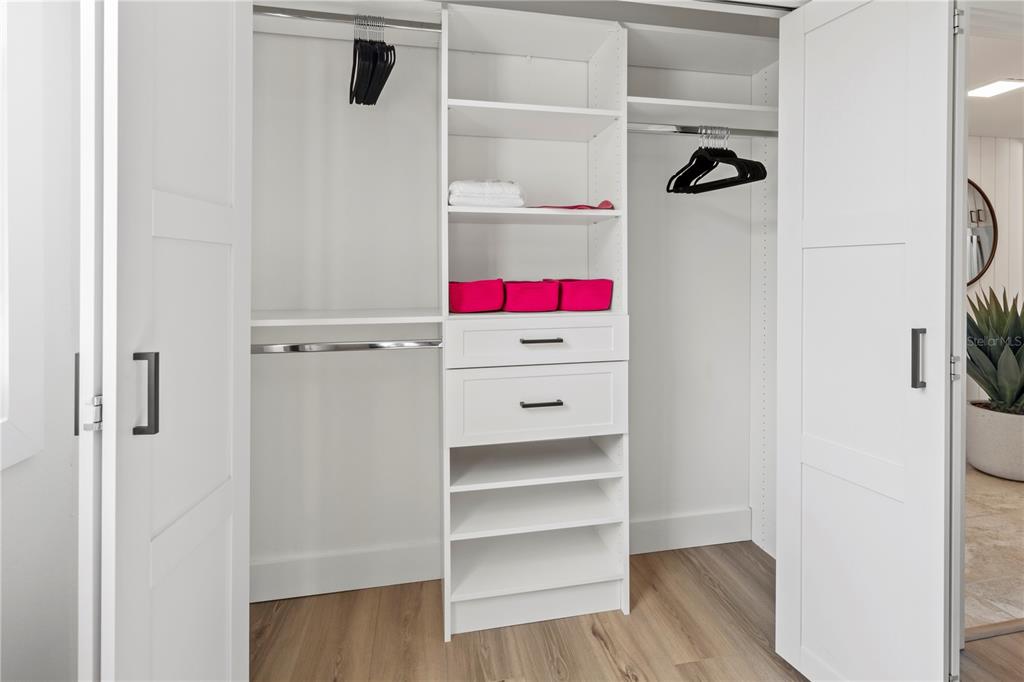 806 Bayport Way, Unit 806 Longboat Key, FL 34228 - Photo 38 of 79 a room with a wooden floor and white walls