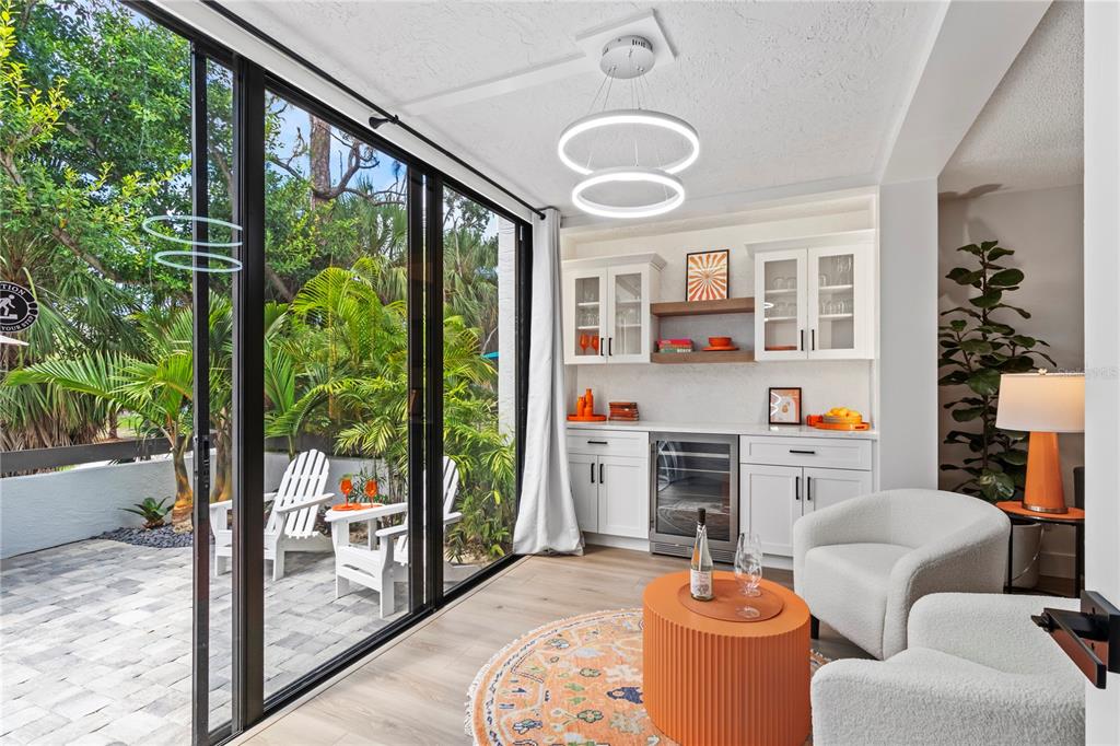 806 Bayport Way, Unit 806 Longboat Key, FL 34228 - Photo 40 of 79 a living room with furniture a fireplace and a floor to ceiling window