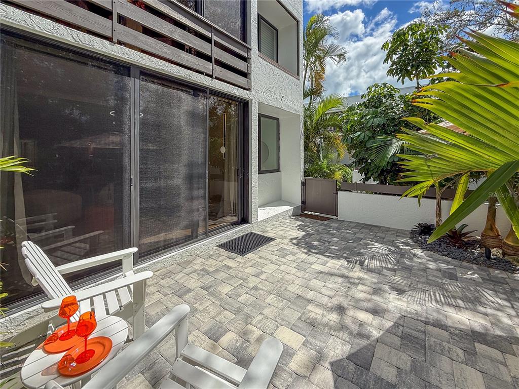 806 Bayport Way, Unit 806 Longboat Key, FL 34228 - Photo 44 of 79 a backyard of a house with seating space