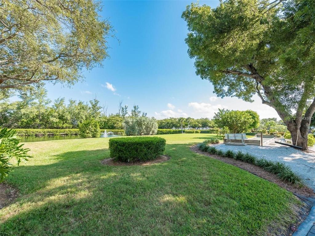 806 Bayport Way, Unit 806 Longboat Key, FL 34228 - Photo 62 of 79 a view of green field with lake view
