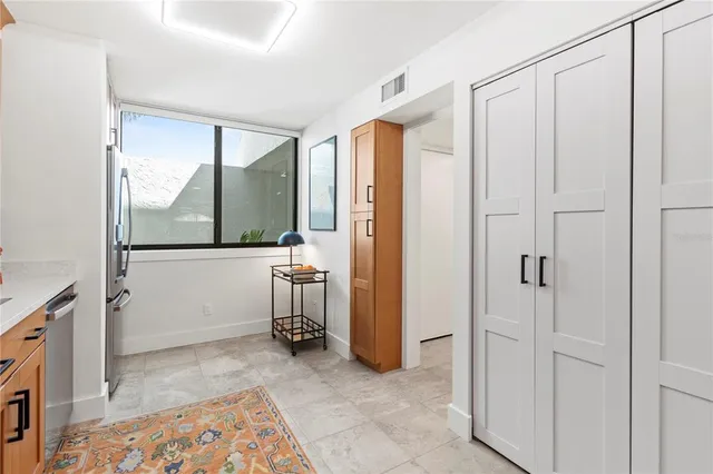 a kitchen with stainless steel appliances granite countertop a sink and cabinets