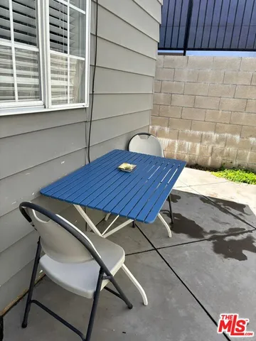 a table and chairs in a patio