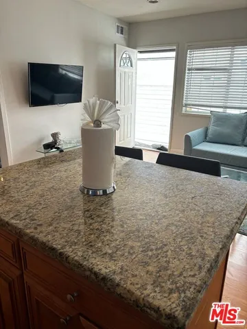 a living room with a couch and a flat screen tv