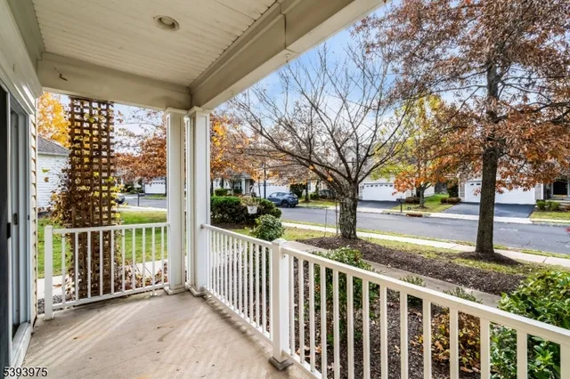 a porch with a trees in front of it