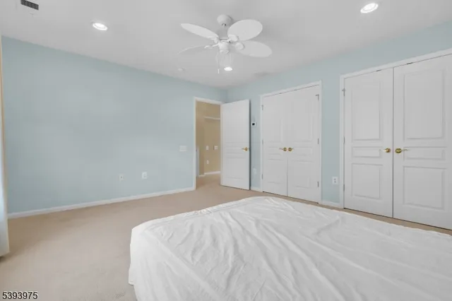 an empty room with bookshelf and a window