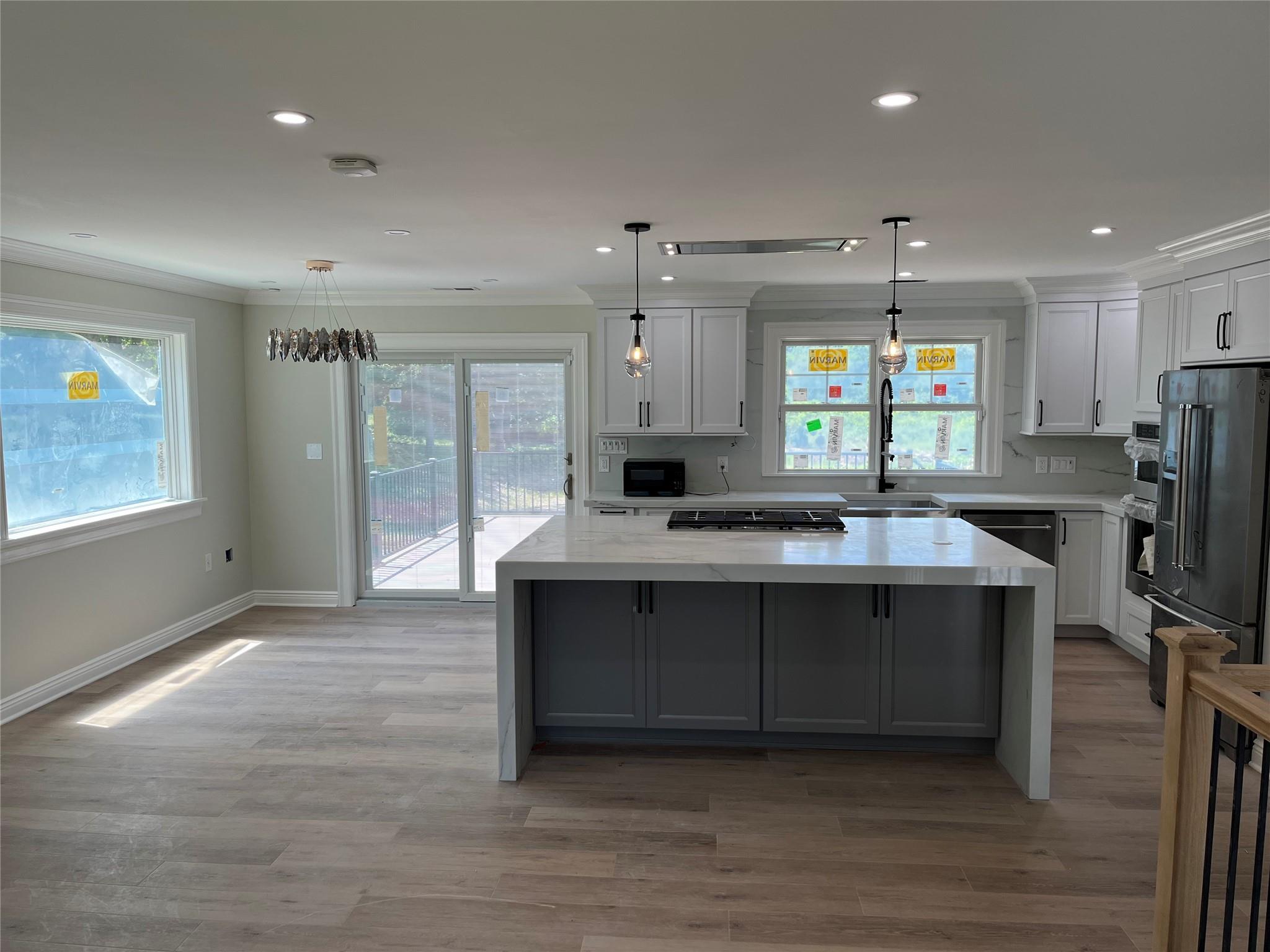 4 Glen Court Poughkeepsie, NY 12603 - Photo 12 of 32 a large kitchen with stainless steel appliances a large counter top a stove a refrigerator and a sink