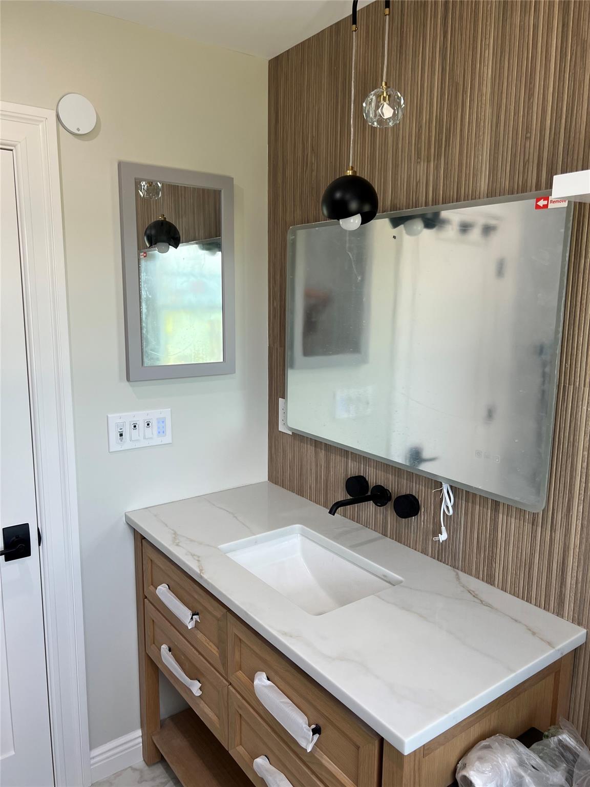 4 Glen Court Poughkeepsie, NY 12603 - Photo 19 of 32 a bathroom with a sink a mirror and shower