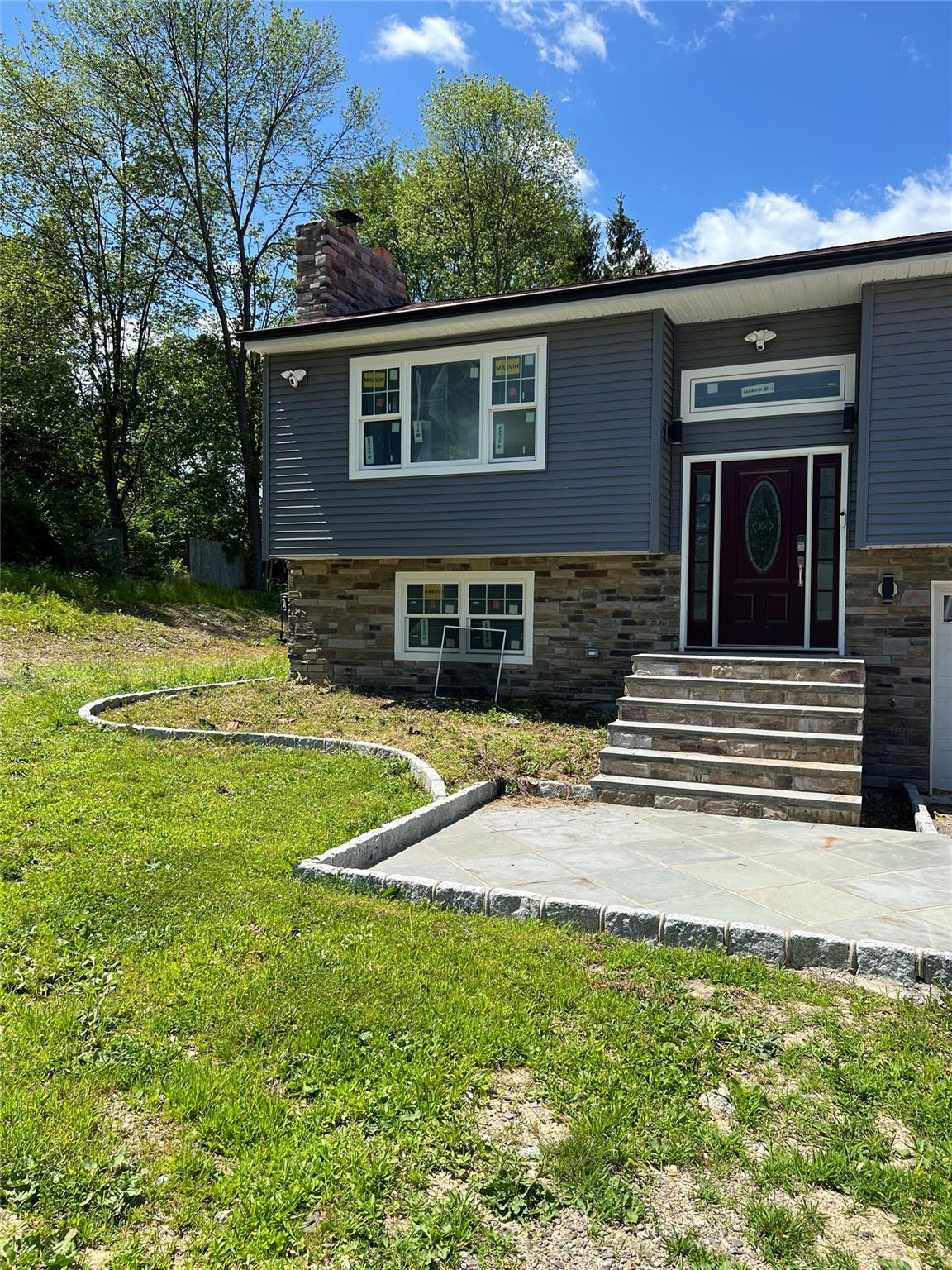 4 Glen Court Poughkeepsie, NY 12603 - Photo 2 of 32 a front view of a house with garden