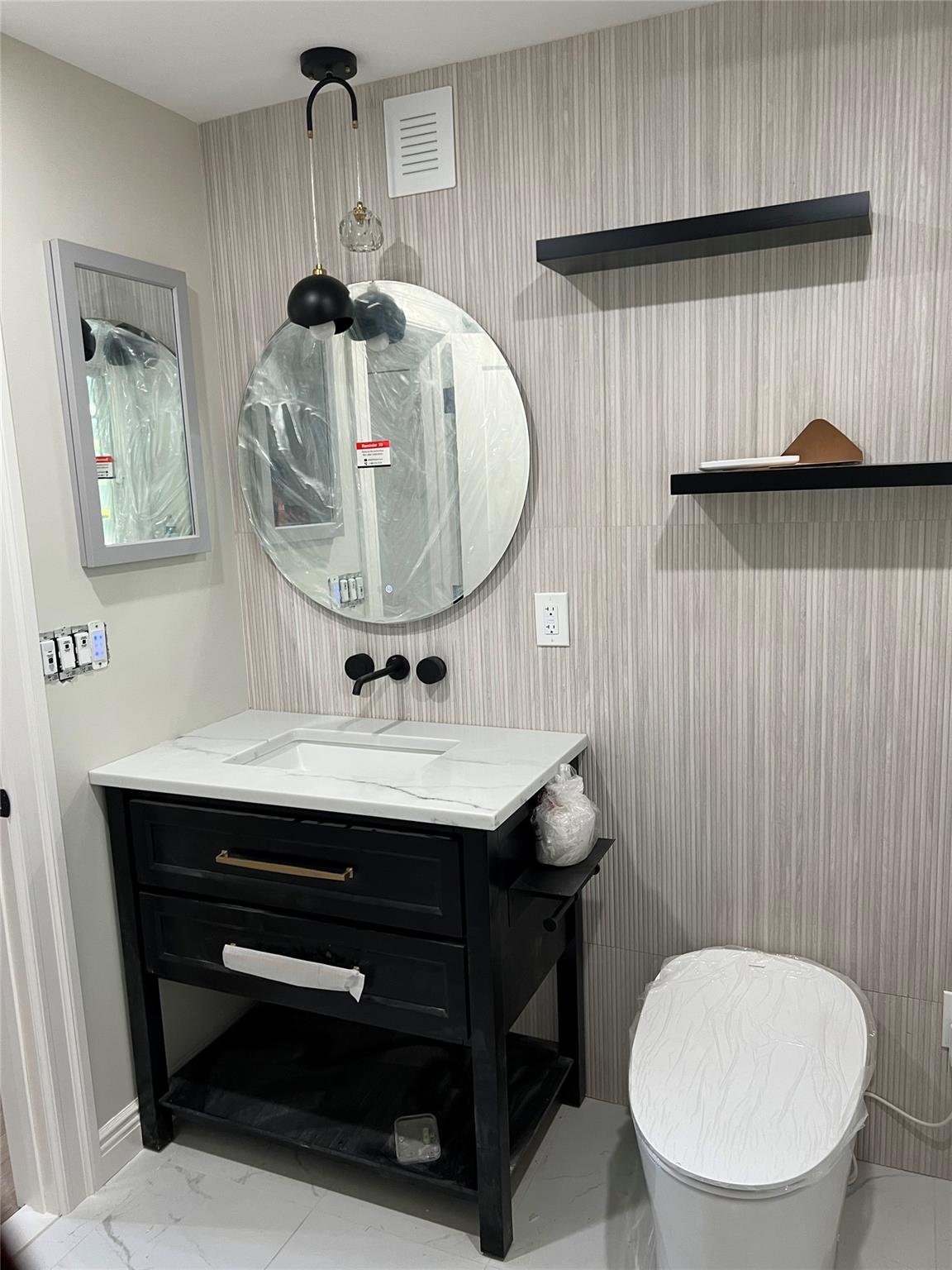 4 Glen Court Poughkeepsie, NY 12603 - Photo 23 of 32 a bathroom with a toilet a sink and mirror