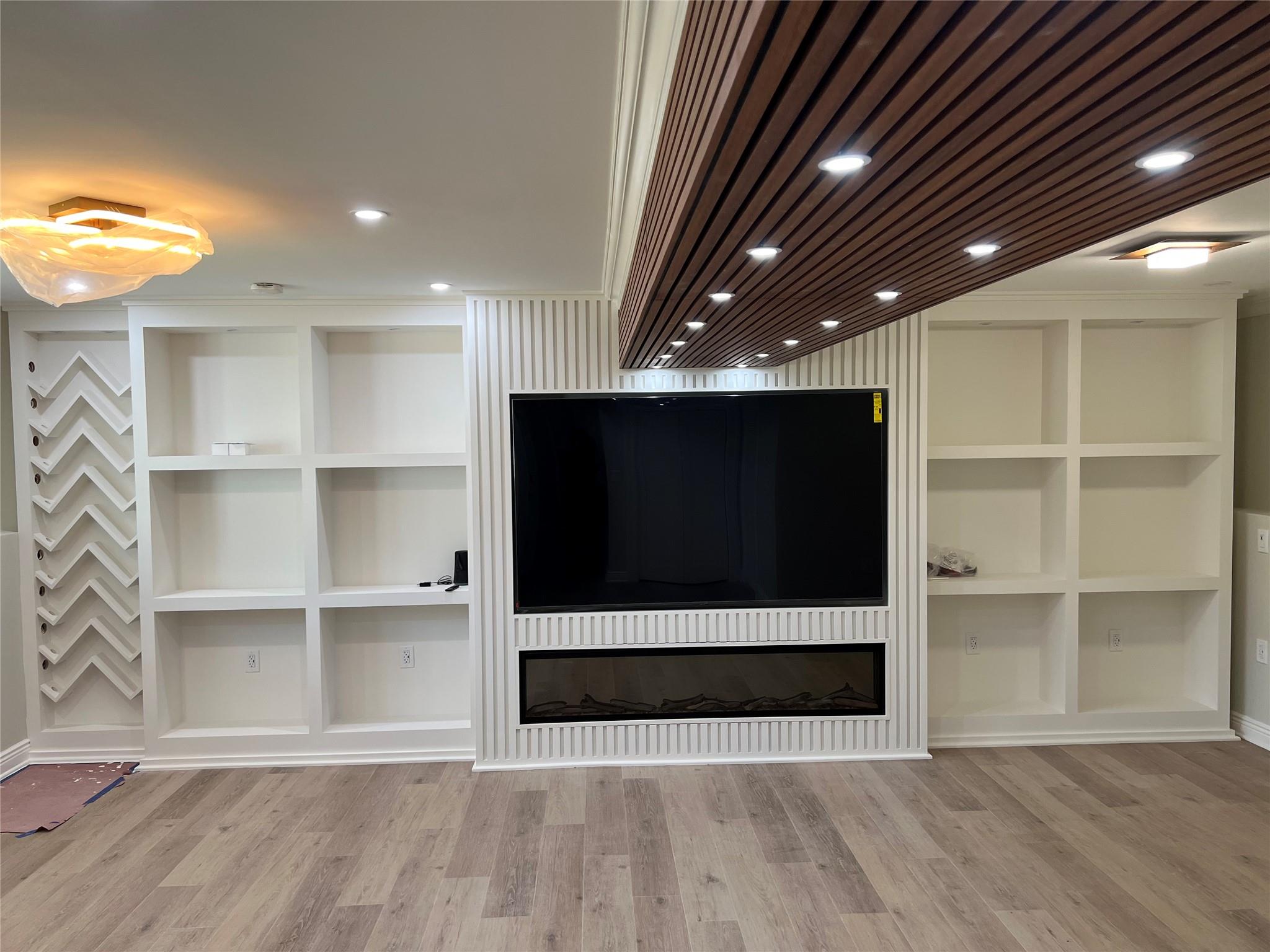 4 Glen Court Poughkeepsie, NY 12603 - Photo 27 of 32 a view of an empty room with a cabinet and a flat screen tv