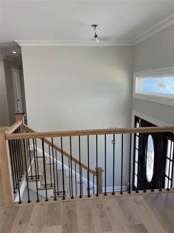 a view of staircase with rug