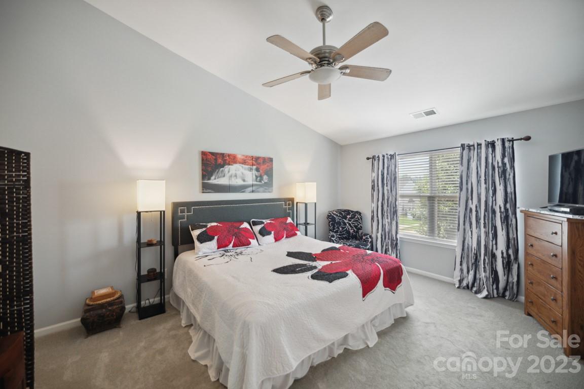 9526 Inglenook Lane Huntersville, NC 28078 - Photo 12 of 20 a bedroom with a bed and a large window