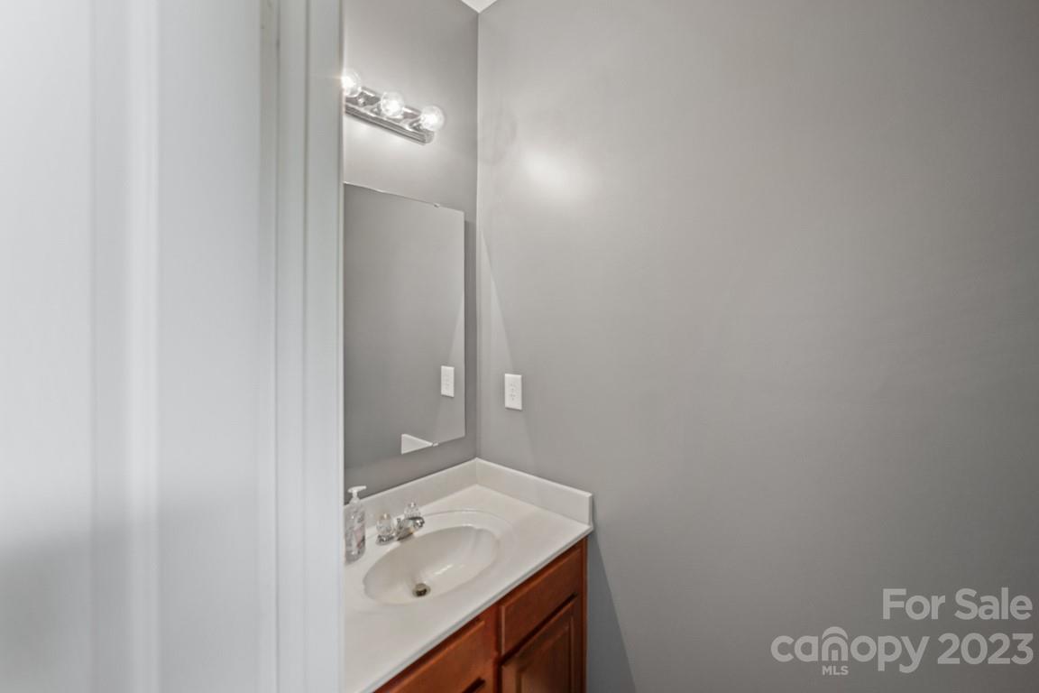 9526 Inglenook Lane Huntersville, NC 28078 - Photo 18 of 20 a bathroom with a sink and vanity