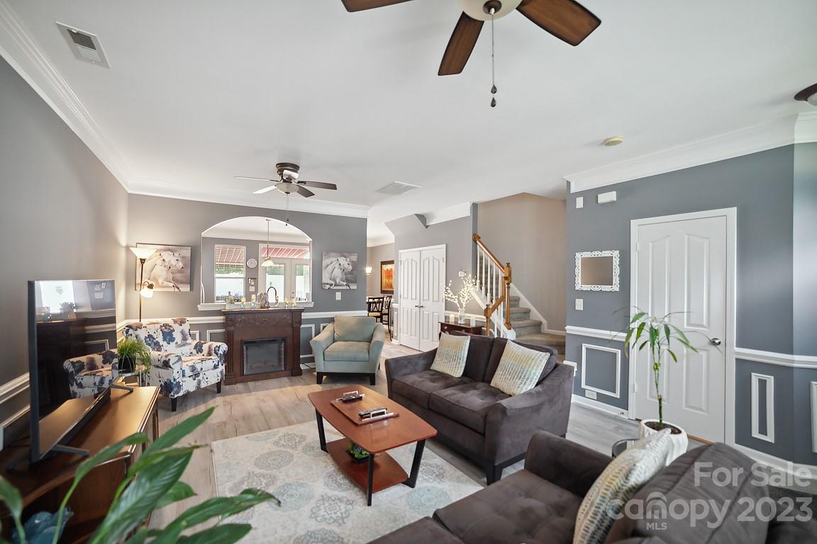 9526 Inglenook Lane Huntersville, NC 28078 - Photo 5 of 20 a living room with furniture and a flat screen tv