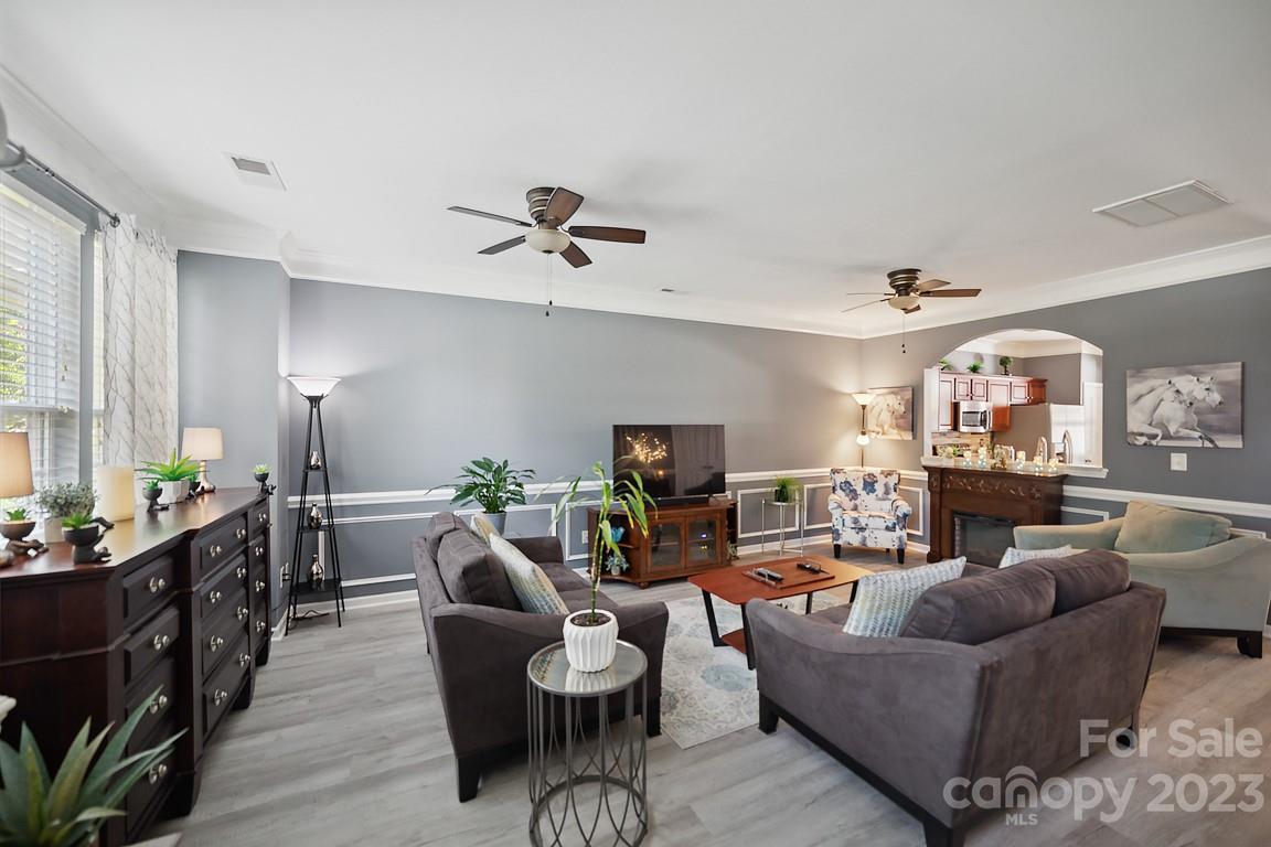 9526 Inglenook Lane Huntersville, NC 28078 - Photo 6 of 20 a living room with furniture and a wooden floor