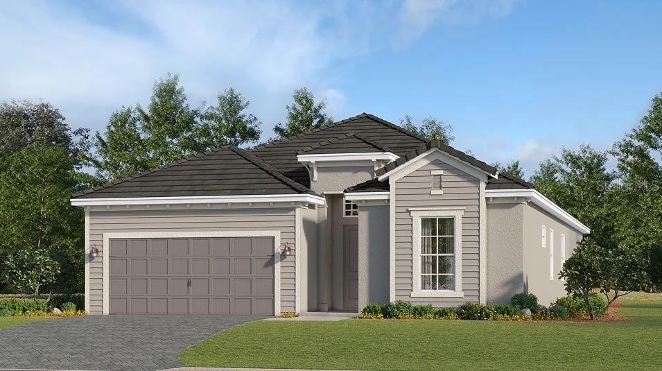 7165 Inlet Isles Lakewood Ranch, FL 34202 - Photo 1 of 26 a front view of a house with a yard