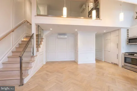 a view of a kitchen with a sink