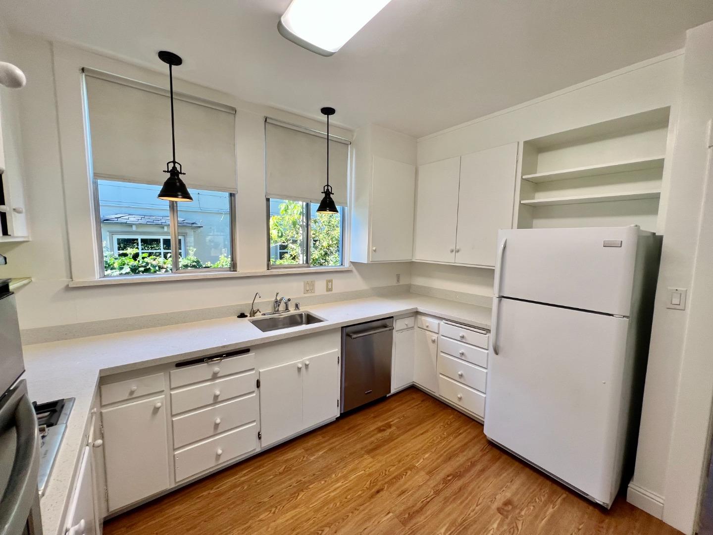1616 Adeline Drive Burlingame, CA 94010 - Photo 11 of 31 a kitchen with white cabinets and white appliances