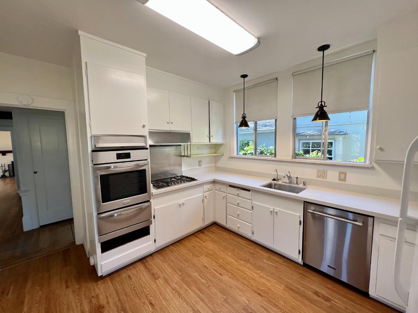 1616 Adeline Drive Burlingame, CA 94010 - Photo 12 of 31 a kitchen with a sink stove and wooden floor