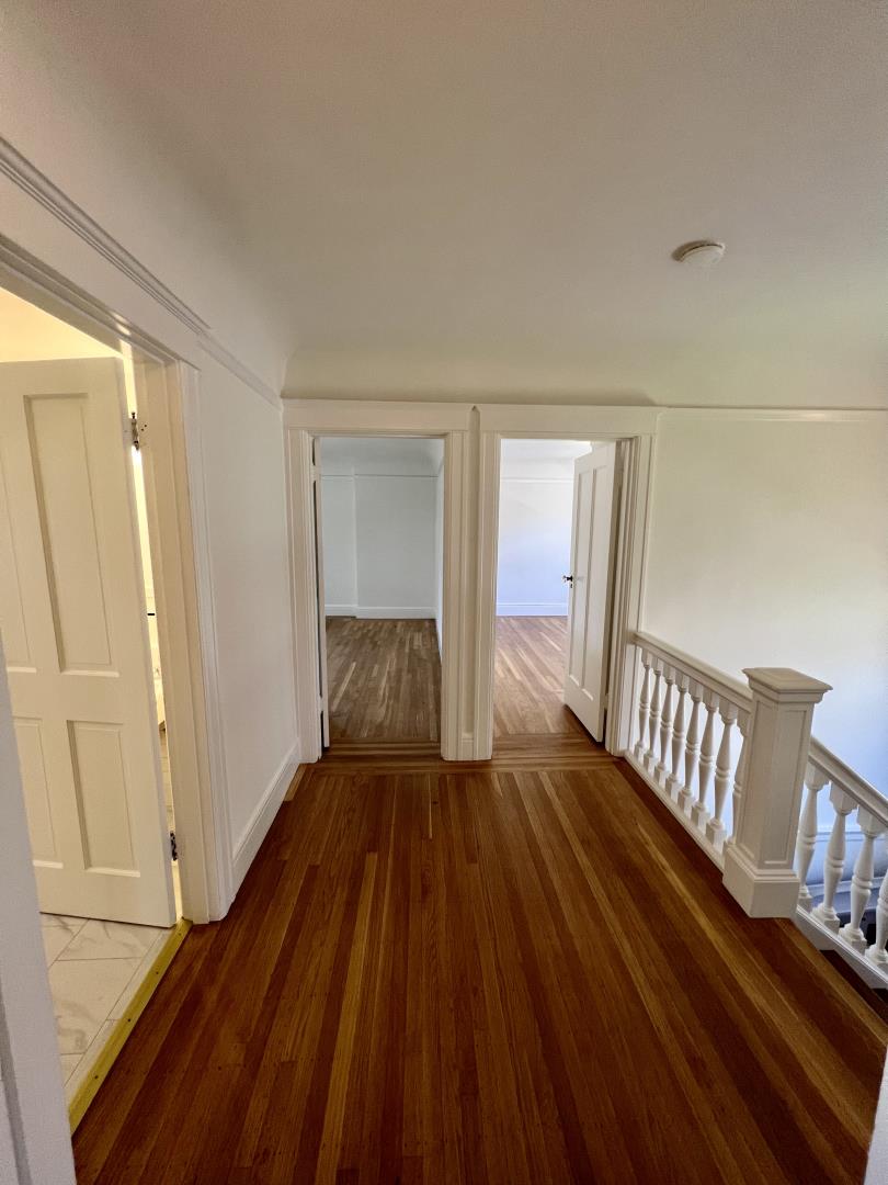 1616 Adeline Drive Burlingame, CA 94010 - Photo 14 of 31 a view of an empty room with wooden floor and a window