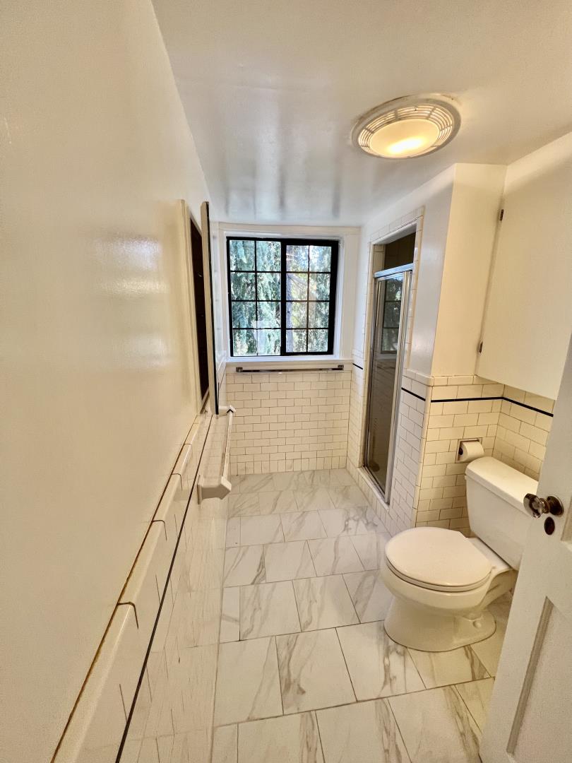 1616 Adeline Drive Burlingame, CA 94010 - Photo 18 of 31 a bathroom with a toilet and a shower